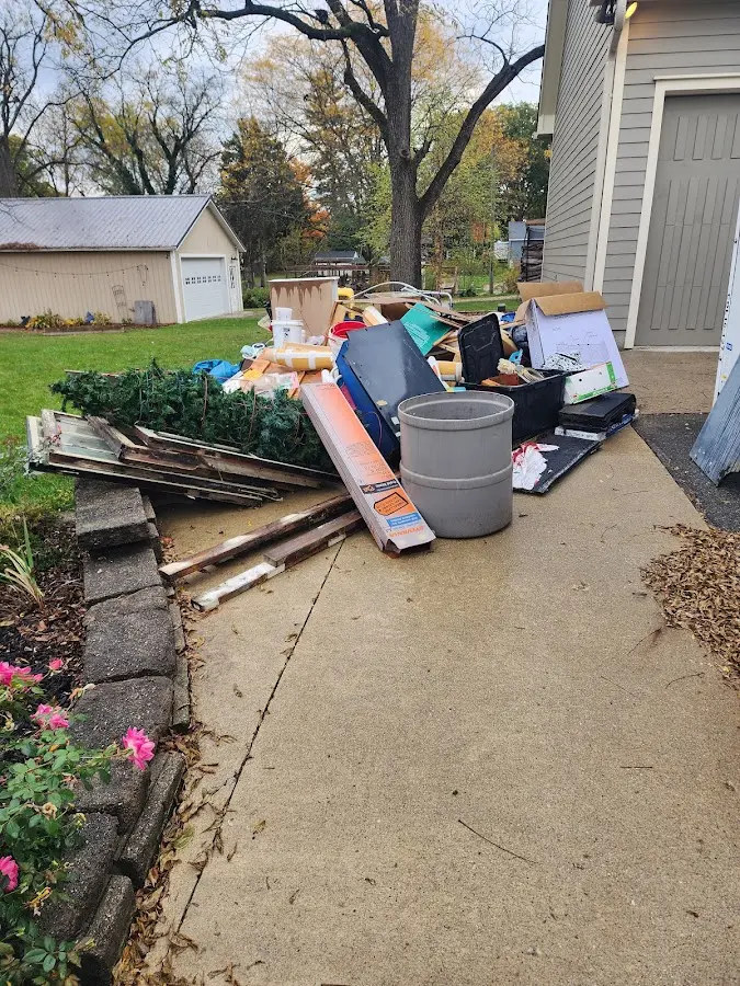 Dumpster being loaded with debris for Commercial Dumpster Rental in Salem